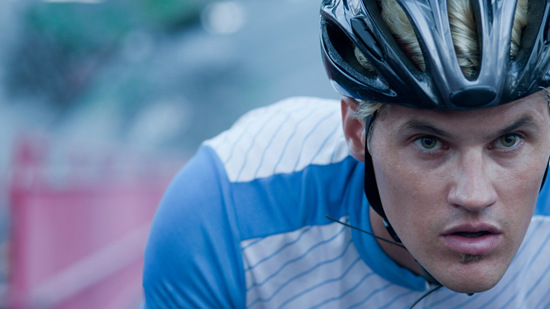 Professional cyclist in race, focused and determined